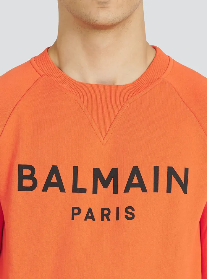 Balmain Sweatshirts Mens EcoDesigned Cotton Sweatshirt With Balmain Paris Metallic Logo Print Orange Balmain Sweatshirts Mens EcoDesigned Cotton Sweatshirt With Balmain Paris Metallic Logo Print Orange