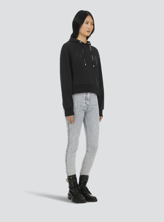 Balmain Sweatshirts Womens Cropped EcoDesigned Cotton Sweatshirt With Rhinestone Balmain Logo Black