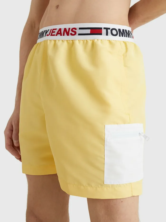 Tommy Hilfiger Logo Waistband Mid Length Swim Shorts Delicate Yellow Mens Swimwear Cheap On Sale Tommy Hilfiger Logo Waistband Mid Length Swim Shorts Delicate Yellow Mens Swimwear Cheap On Sale